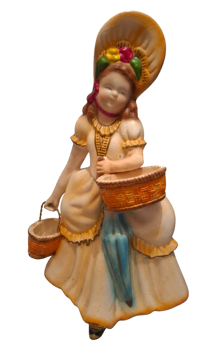 Figura de pastorinha em porcelana, com cesto e sombrinha